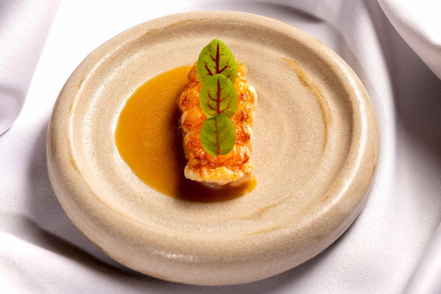 Tristan langoustine, champagne beurre blanc and yuzu gel © Claus Kadrnoschka