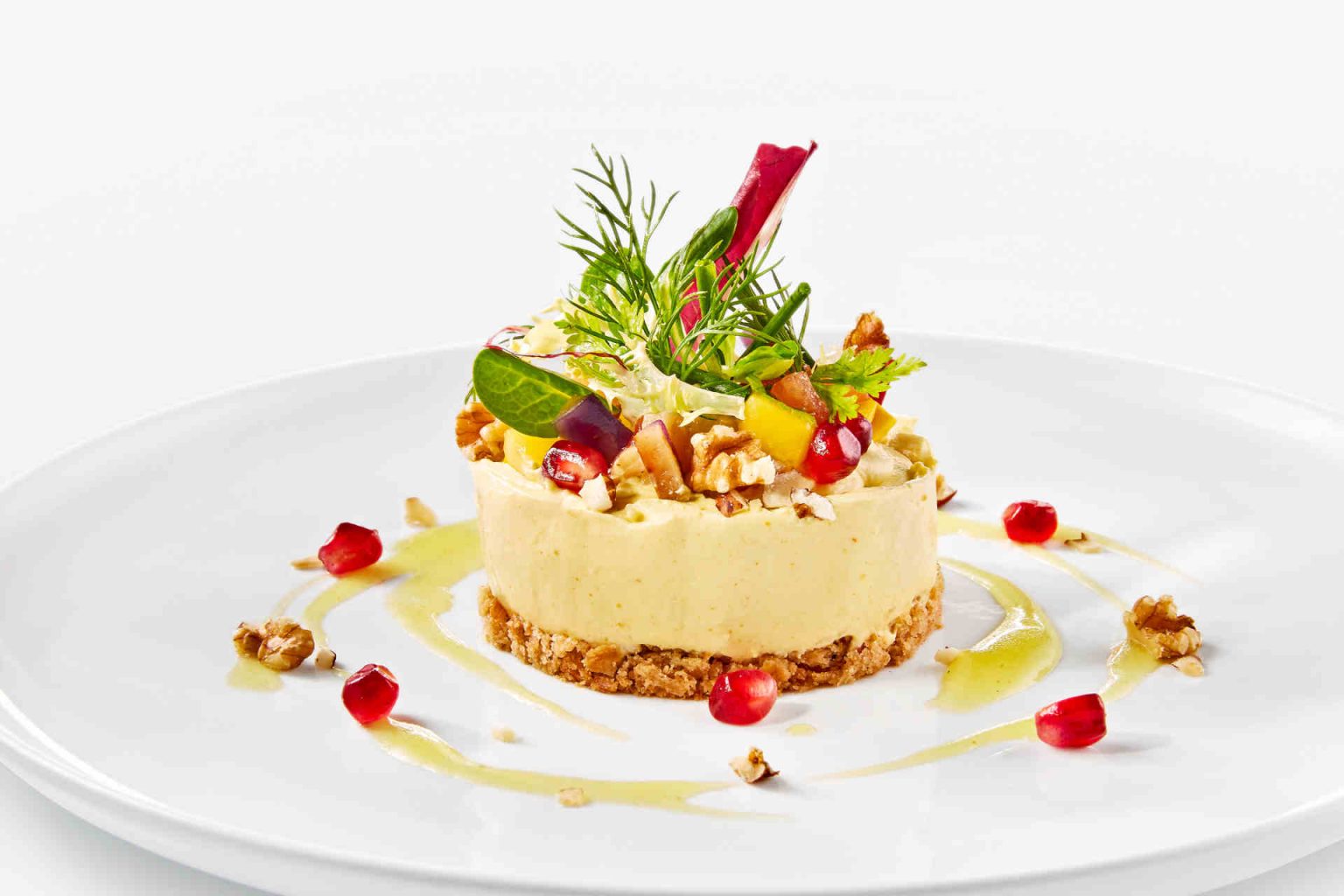 Starter: Goat cheese and caramel tartlets with chili and walnut crunch on winter leaf salads, photo provided